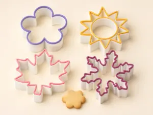 Seasonal cookie cutter collection featuring flower, sun, autumn leaf and snowflake shapes