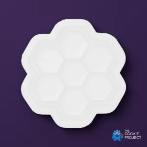 Honeycomb Cookie Cutter - white cutter viewed directly from above on dark purple