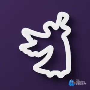 Nativity Angel Cookie Cutter - white cutter viewed directly from above on dark purple