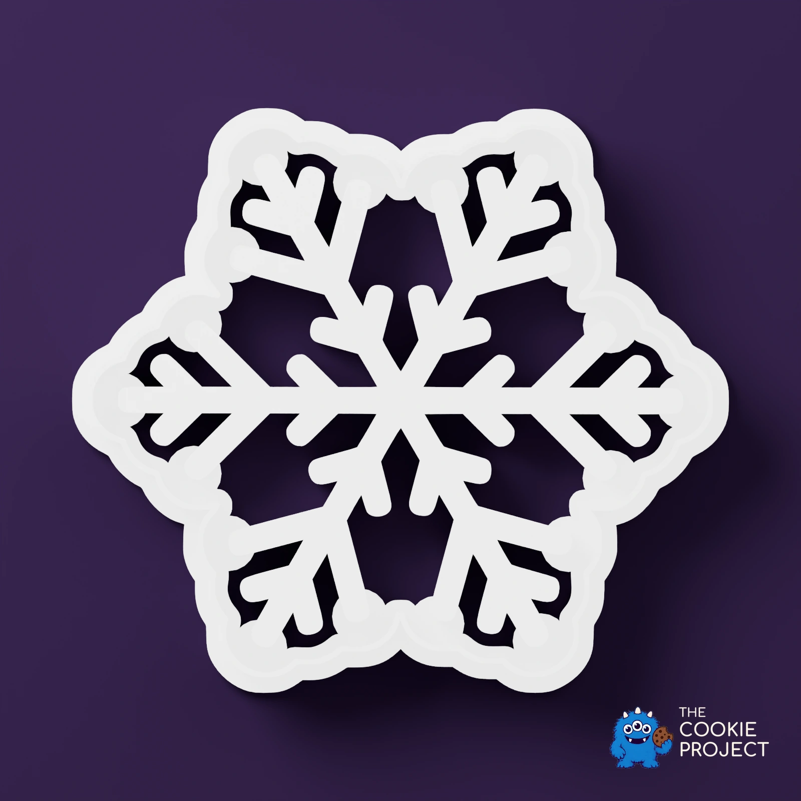 Christmas Cookie Cutter Set of 7 - white cutter viewed directly from above on dark purple