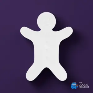 Gingerbread Person Cookie Cutter - white cutter viewed directly from above on dark purple