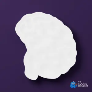 Brain Cookie Cutter - white cutter viewed directly from above on dark purple