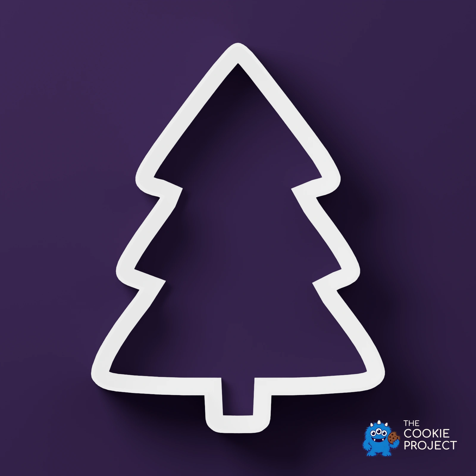 Christmas Cookie Cutter Set of 7 - white cutter viewed directly from above on dark purple