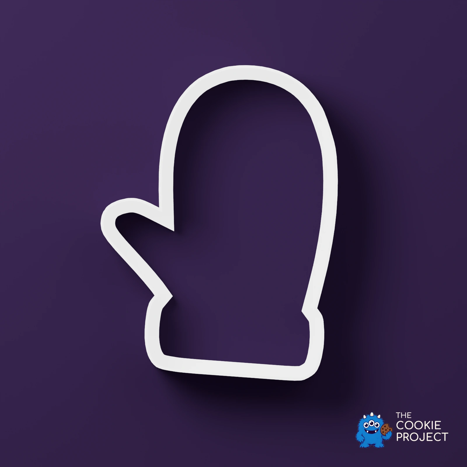 Christmas Cookie Cutter Set of 7 - white cutter viewed directly from above on dark purple