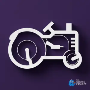 Tractor Outline Cookie Cutter - white cutter viewed directly from above on dark purple