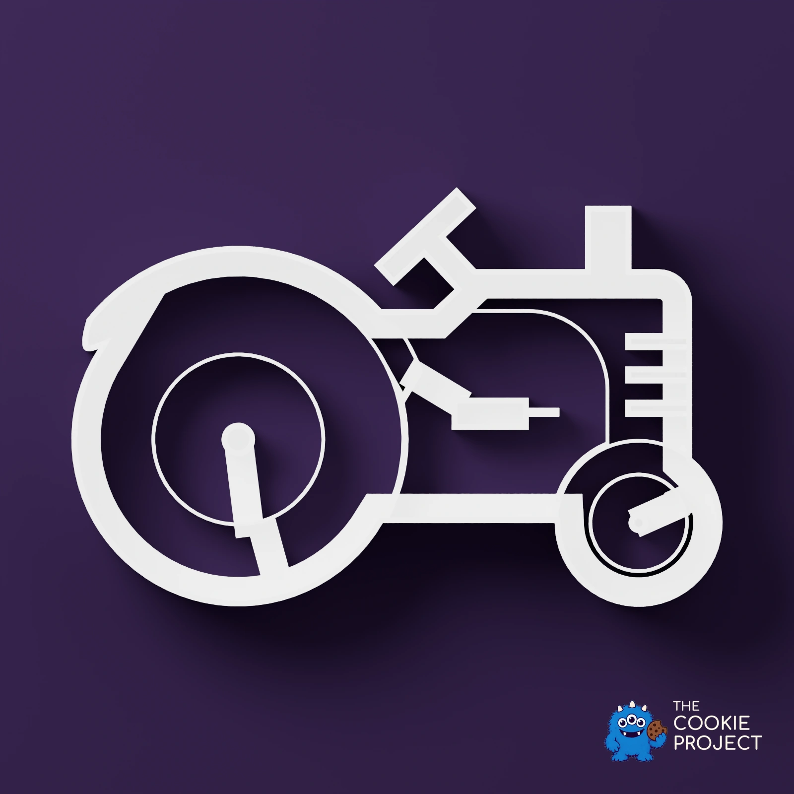 Tractor Outline Cookie Cutter - white cutter viewed directly from above on dark purple