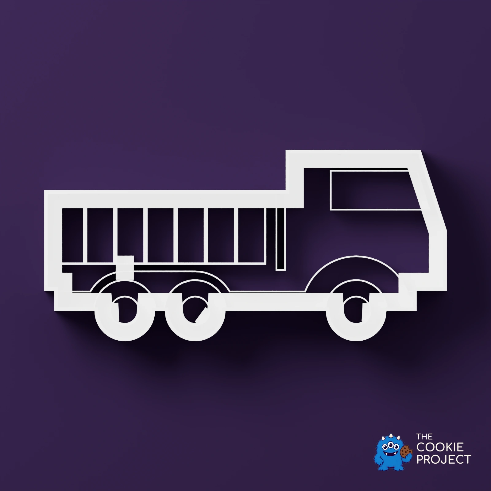 Truck Outline Cookie Cutter - white cutter viewed directly from above on dark purple