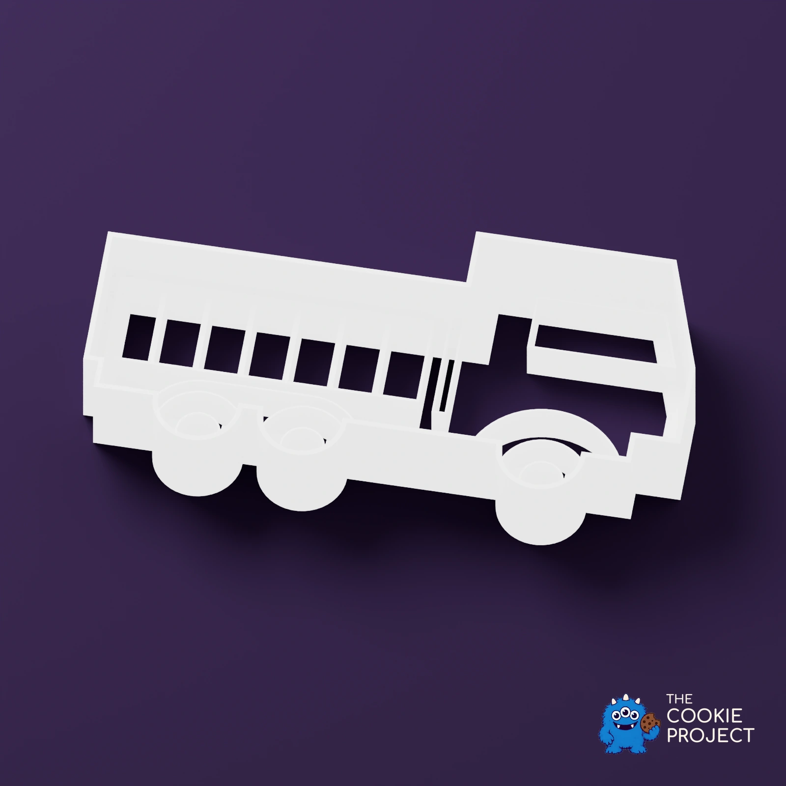 Truck Outline Cookie Cutter - white cutter viewed from an elevated side angle on dark purple