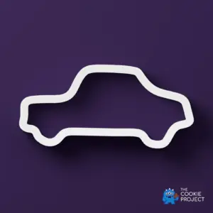 Car Outline Cookie Cutter - white cutter viewed directly from above on dark purple