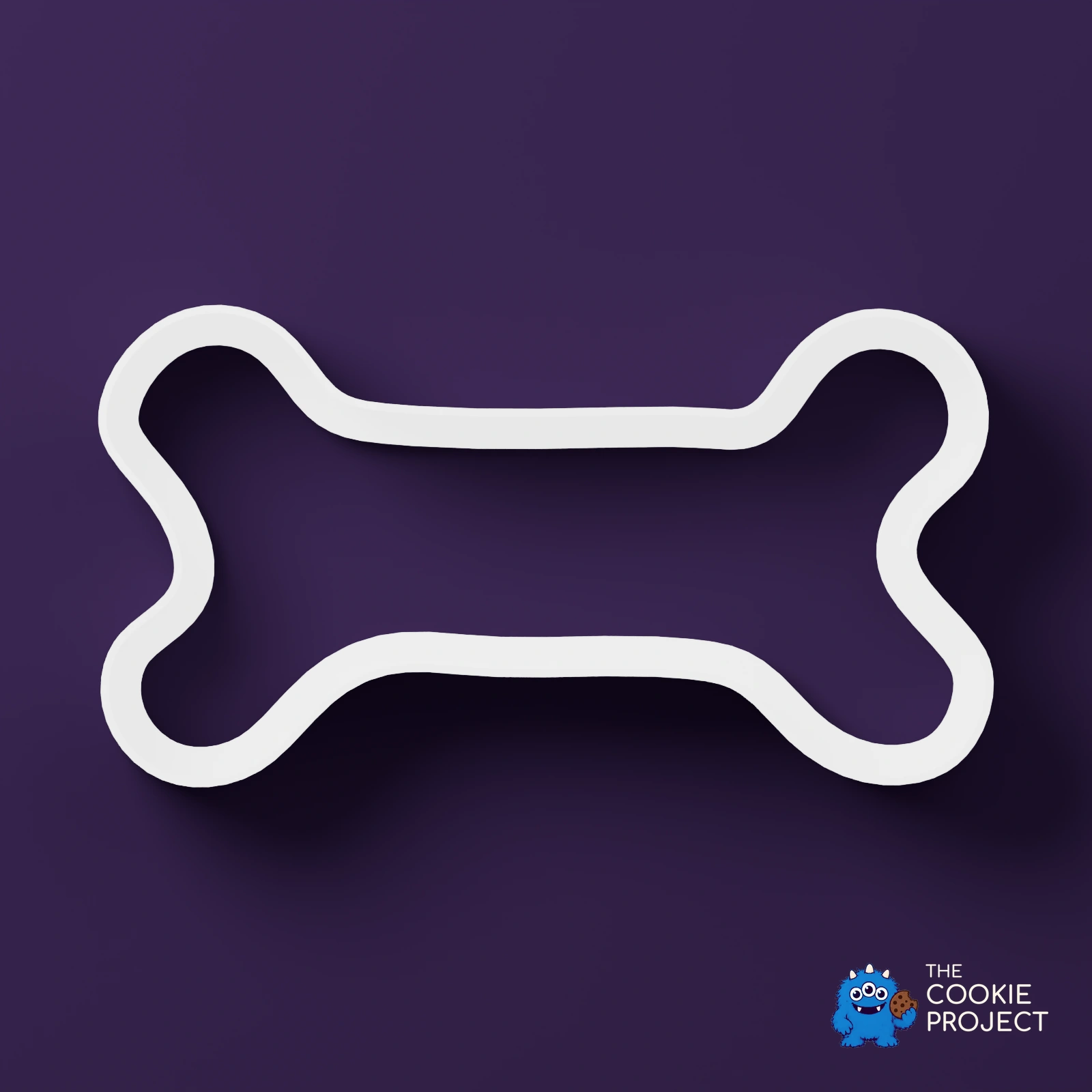 Mixed Cookie Cutter Collection of 9 - white cutter viewed directly from above on dark purple