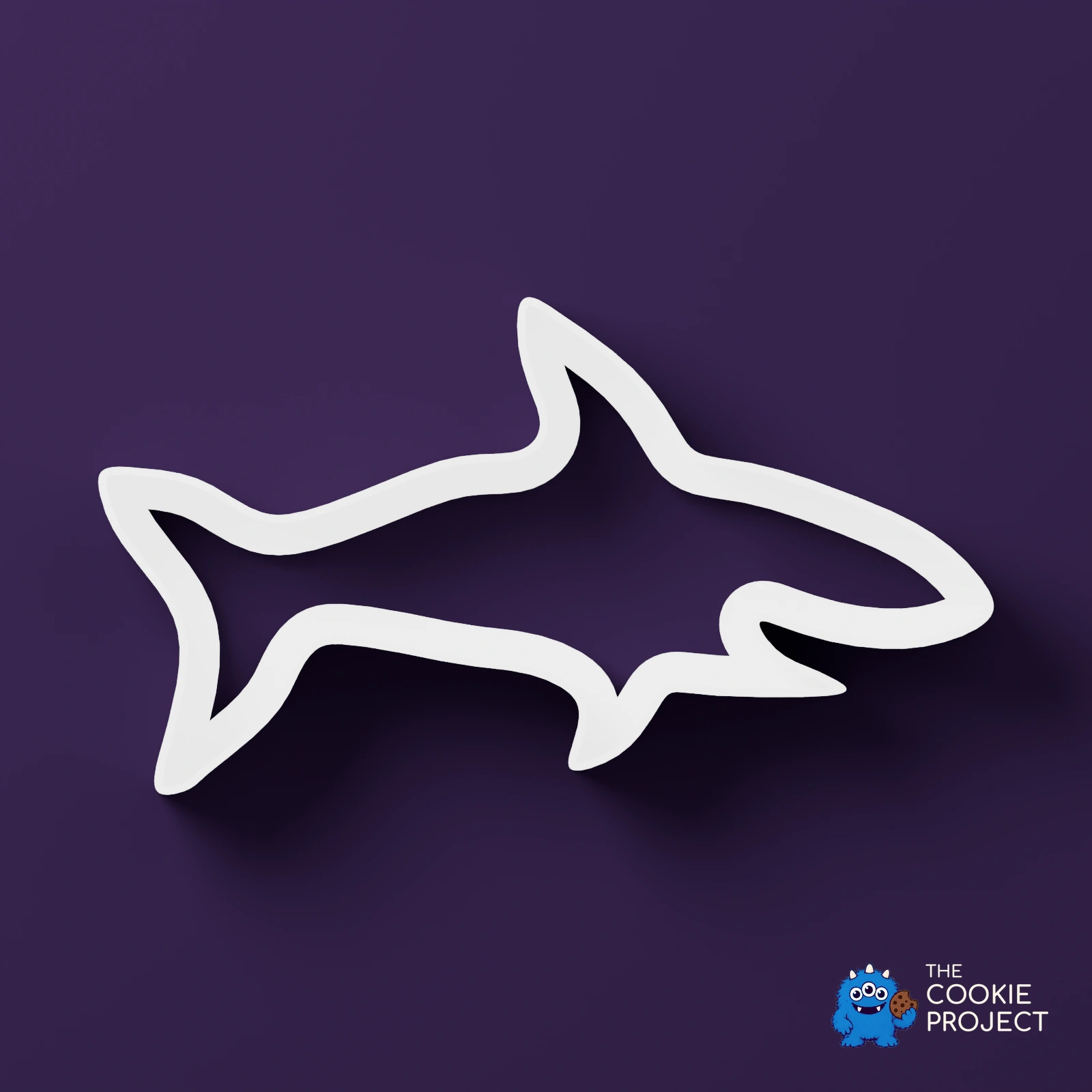 Mixed Cookie Cutter Collection of 9 - white cutter viewed directly from above on dark purple