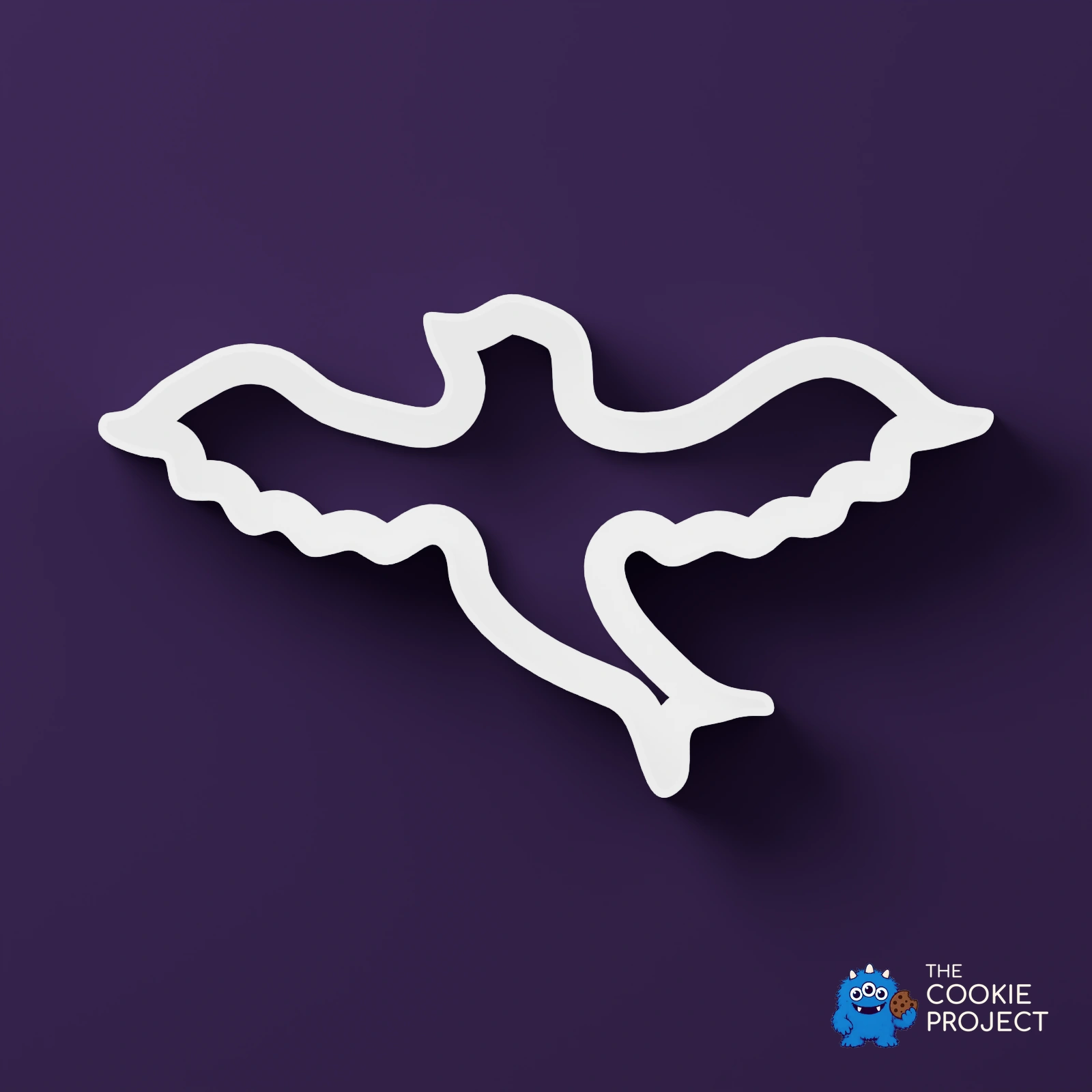 Mixed Cookie Cutter Collection of 9 - white cutter viewed directly from above on dark purple