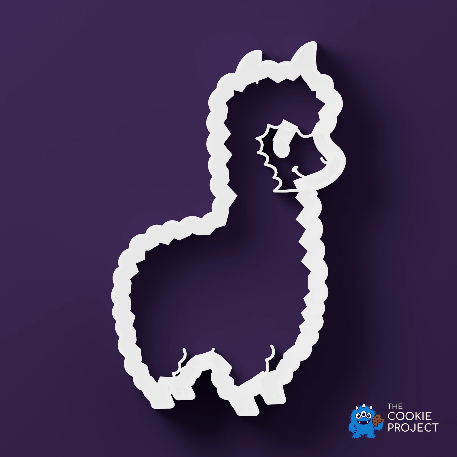 Alpaca and Llama Cookie Cutter Set of 2 - white cutter viewed directly from above on dark purple