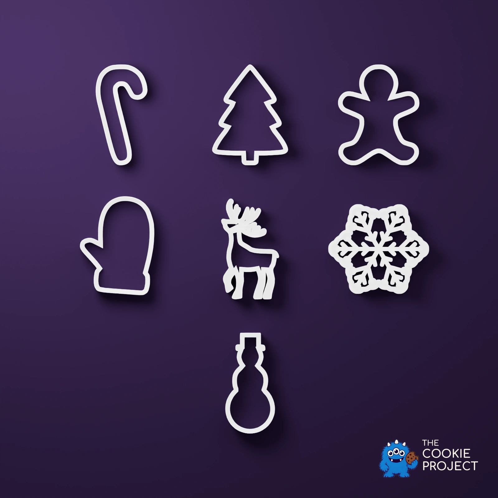 Christmas Cookie Cutter Set of 7 - white complete set viewed directly from above on dark purple