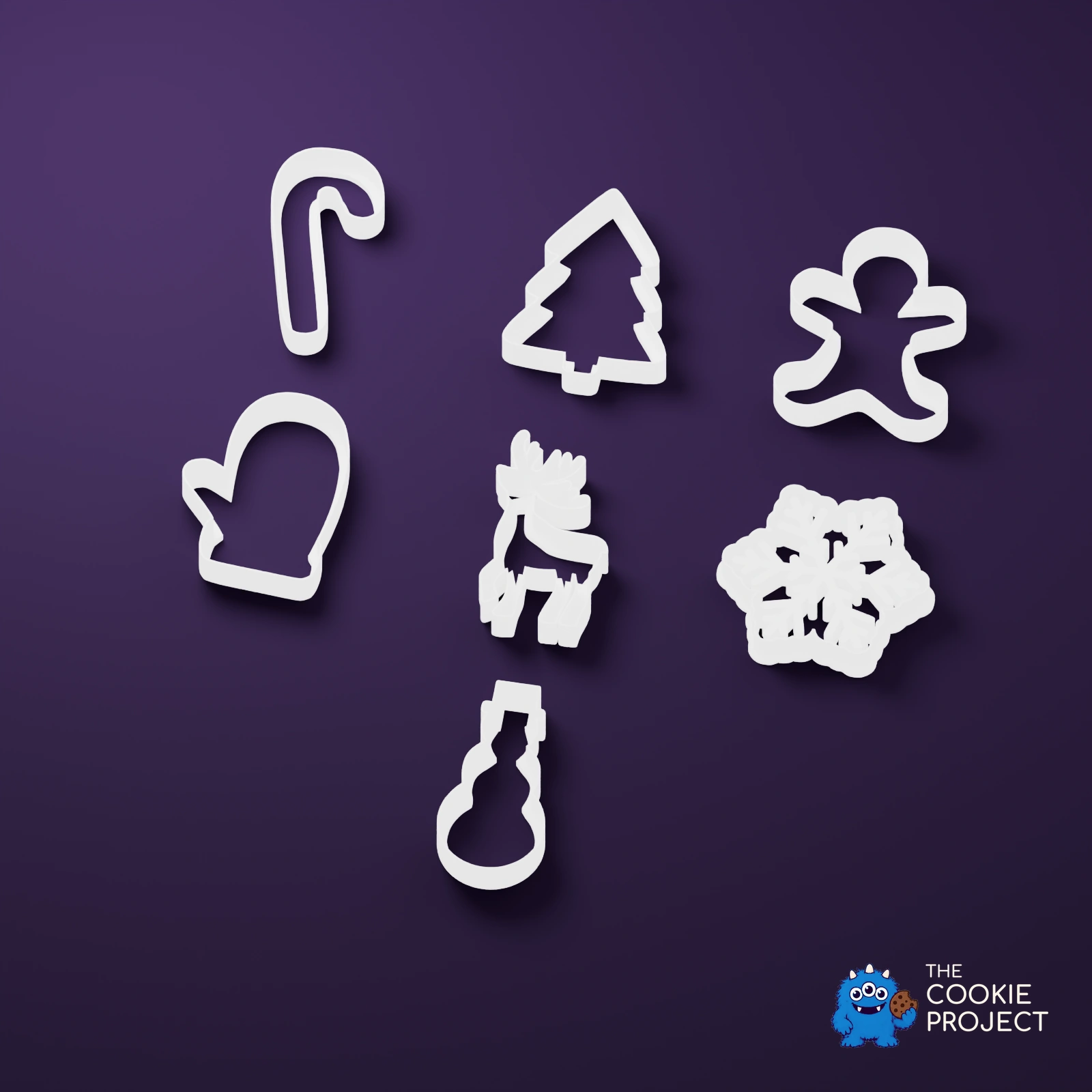 Christmas Cookie Cutter Set of 7 - white complete set viewed from an elevated side angle on dark purple