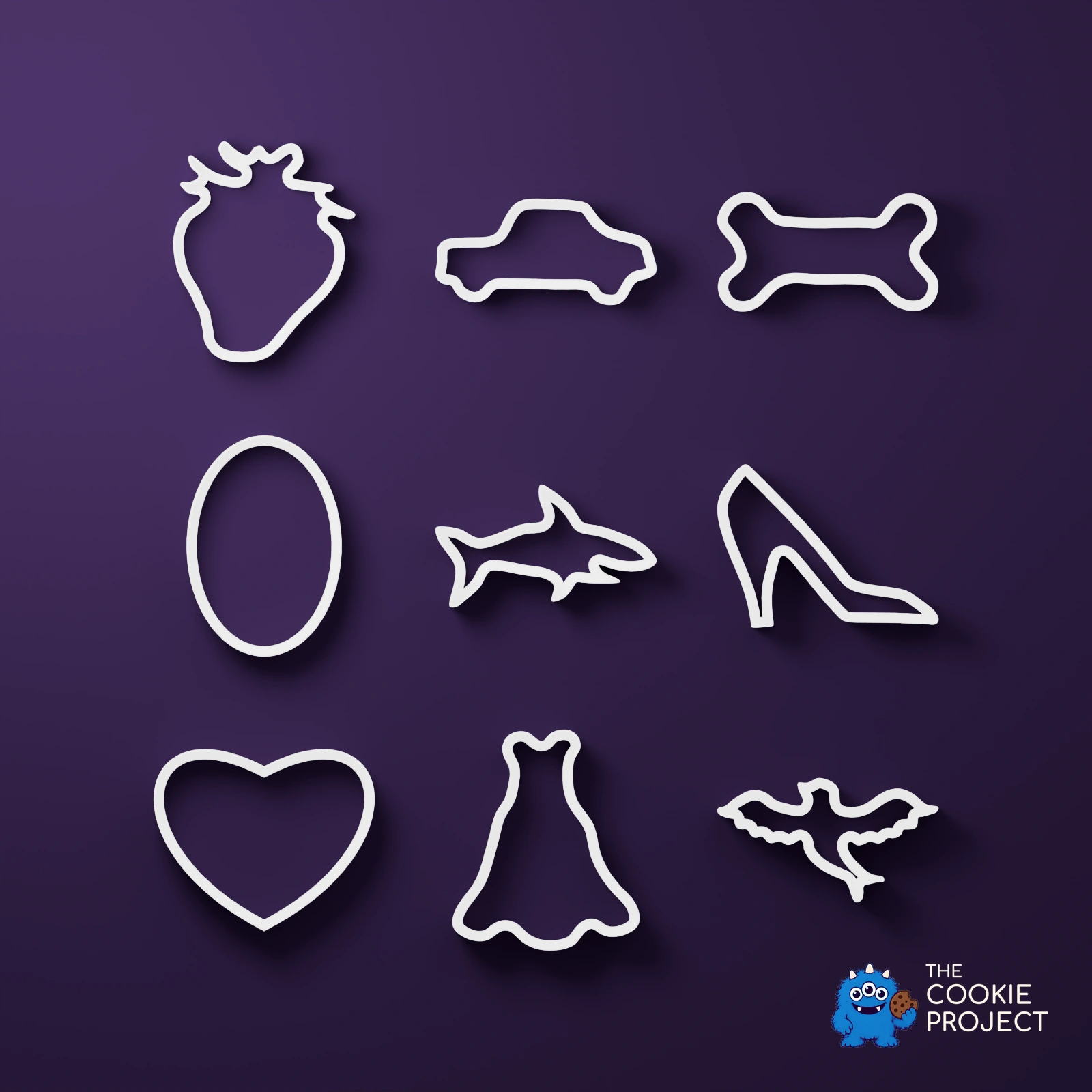 Mixed Cookie Cutter Collection of 9 - white complete set viewed directly from above on dark purple