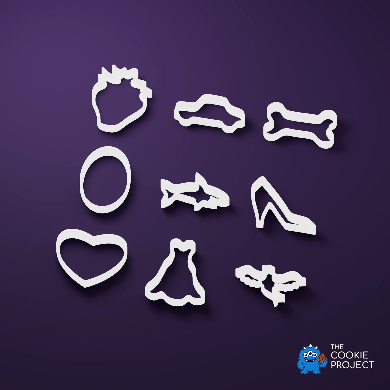 Mixed Cookie Cutter Collection of 9 - white complete set viewed from an elevated side angle on dark purple