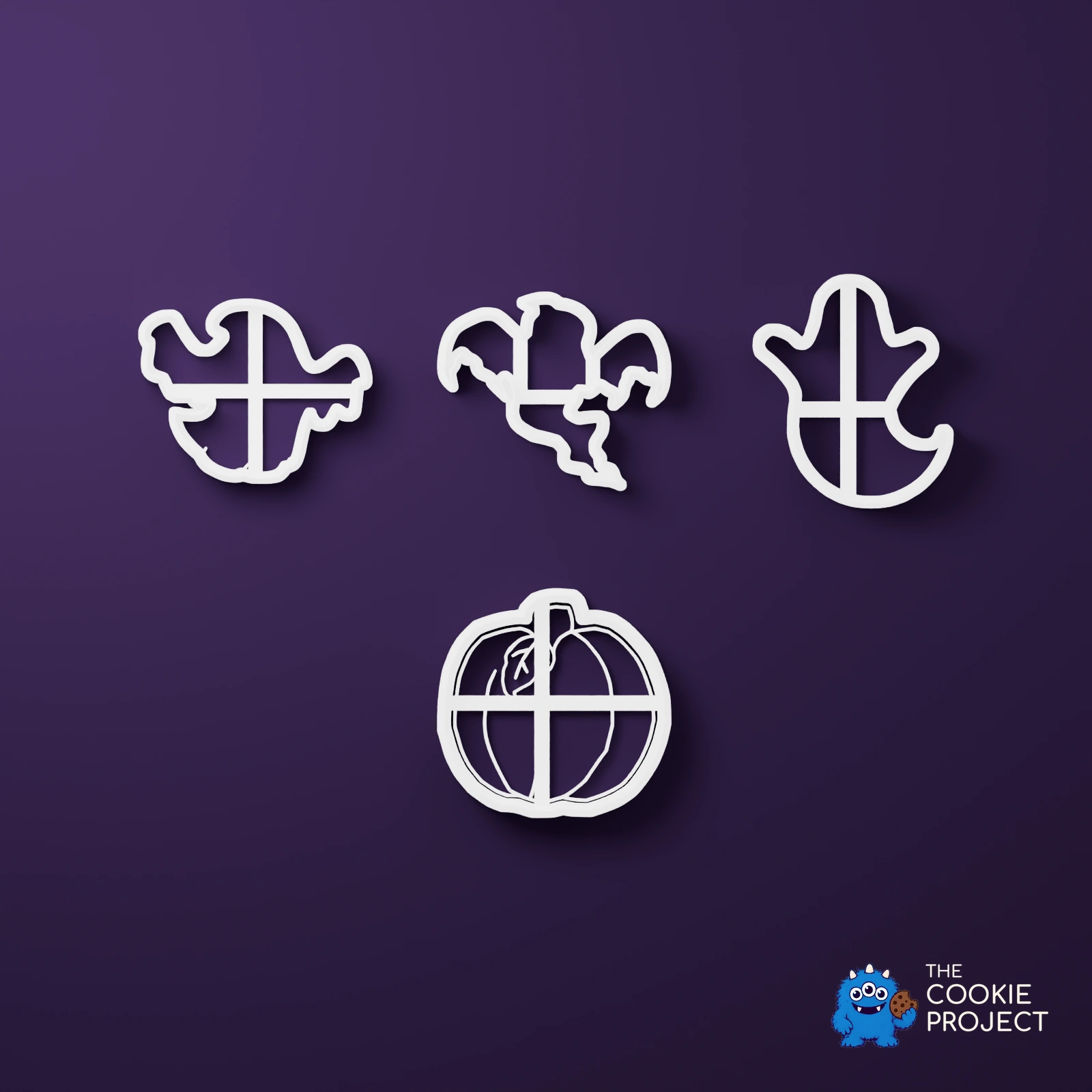 Ghost and Pumpkin Cookie Cutter Set of 4 - bright white complete tools viewed directly from above on dark purple
